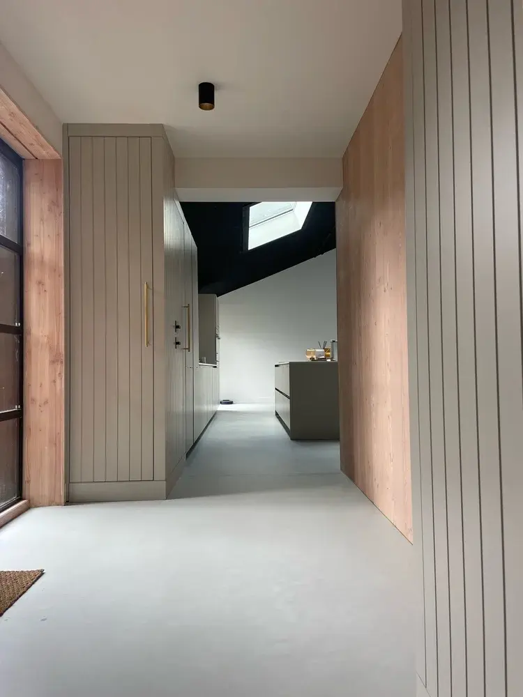 Detail of microcement floor surface showing warm neutral tone and matte sealed finish — Beaumaris