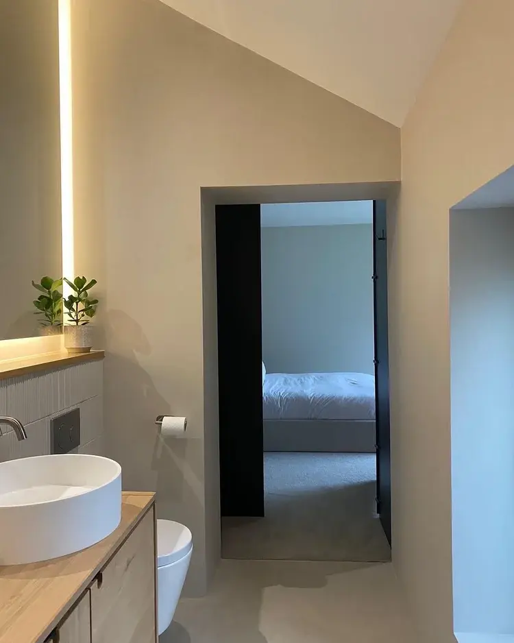 Full view of seamless microcement bathroom with warm walls and floor — Hampton