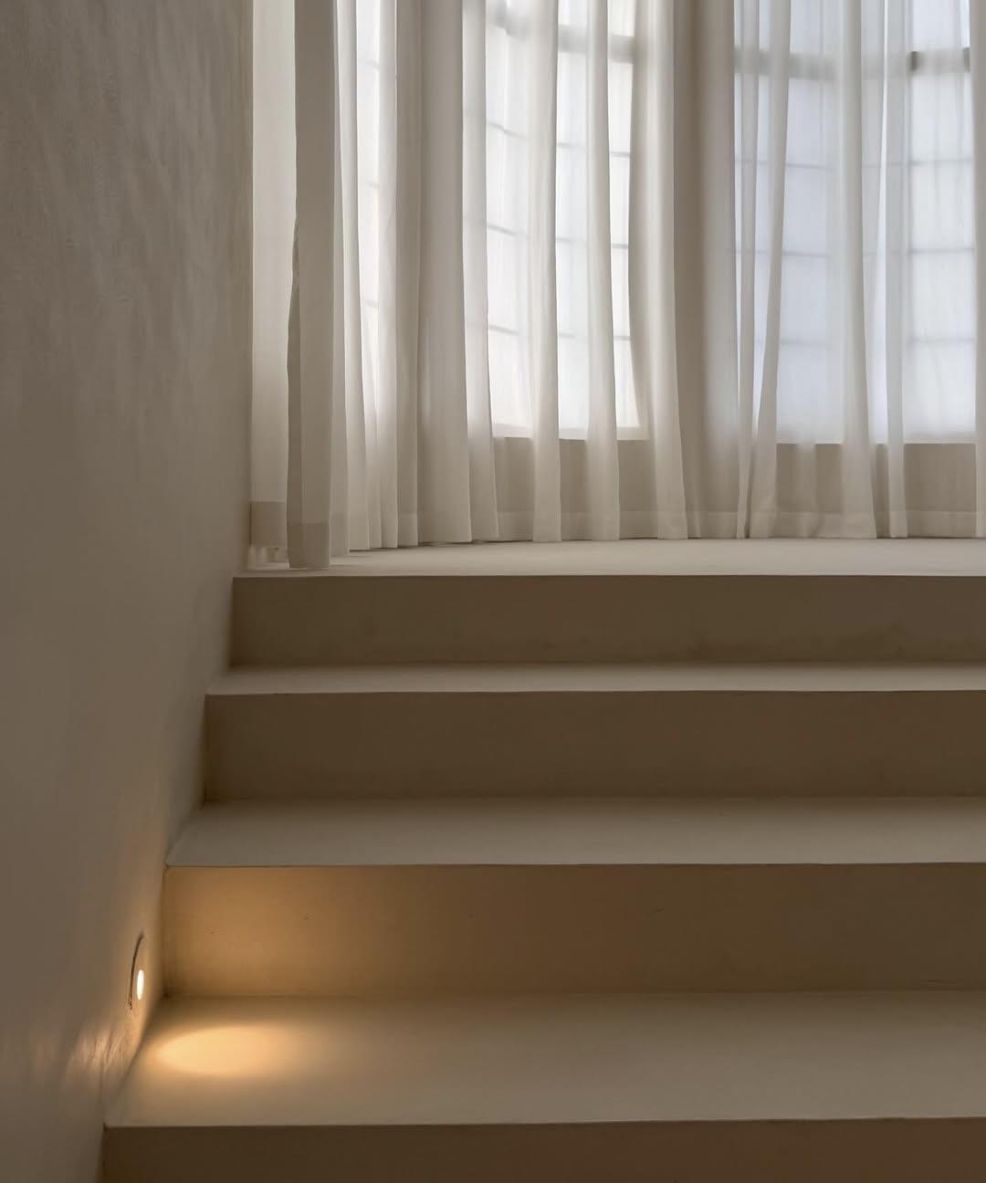 Close-up of microcement stair tread and riser junction with matte sealed surface — Toorak