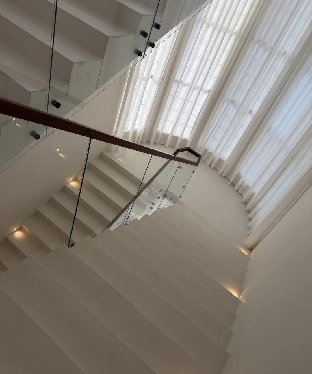 Upper landing view of microcement staircase blending into surrounding interior — Toorak