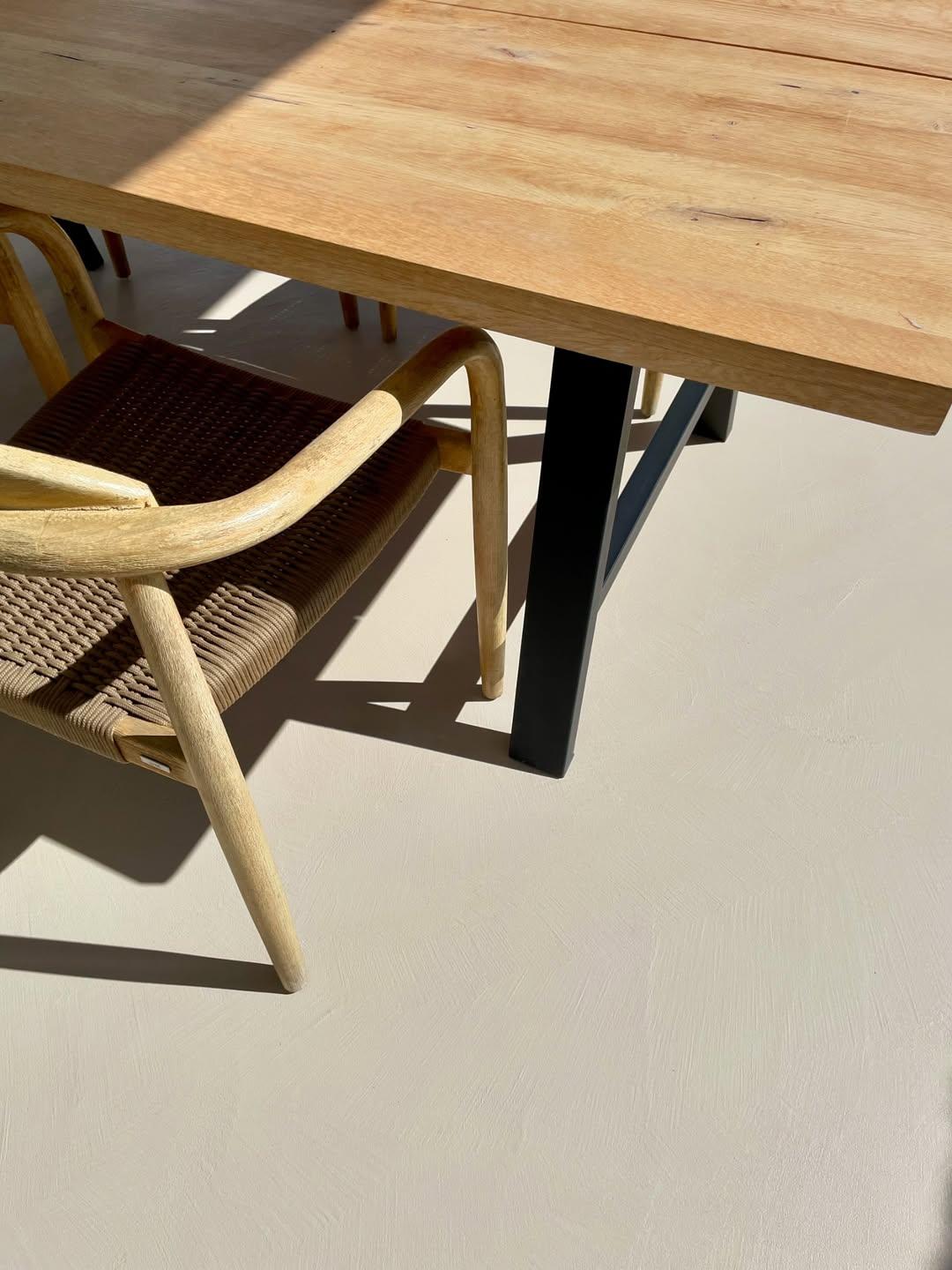 Outdoor microcement area showing transition to surrounding landscaping and architectural elements — Brighton
