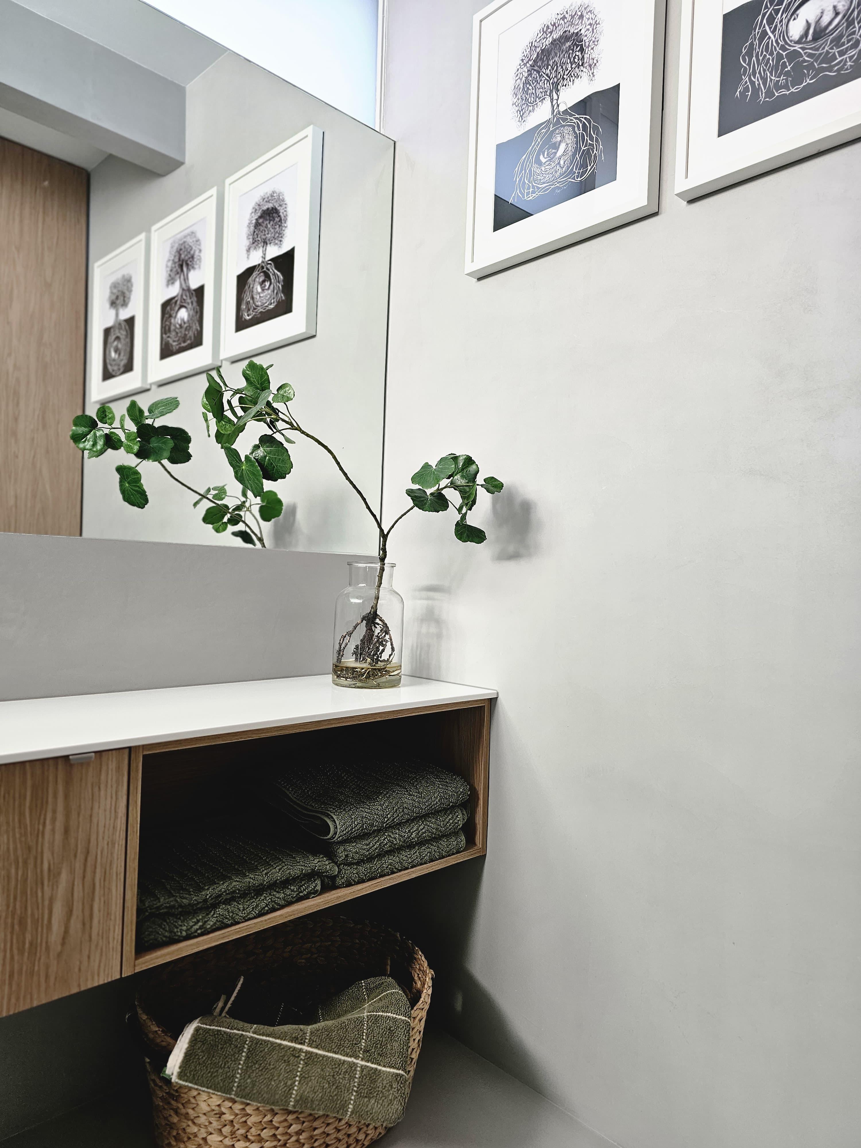 Vanity and shower wider context shot in grey microcement ensuite — Richmond